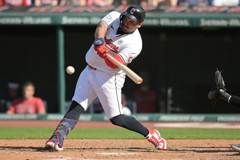 Sep 15, 2024; Cleveland, Ohio, USA; Cleveland Guardians first baseman Josh Naylor (22) hits a single during the eighth inning against the Tampa Bay Rays at Progressive Field. Mandatory Credit: Ken Blaze-Imagn Images