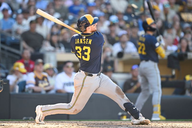 Sep 24, 2025; San Diego, California, USA; Milwaukee Brewers catcher Danny Jansen (33) hits a solo home run during the ninth inning against the San Diego Padres at Petco Park. Mandatory Credit: Denis Poroy-Imagn Images
