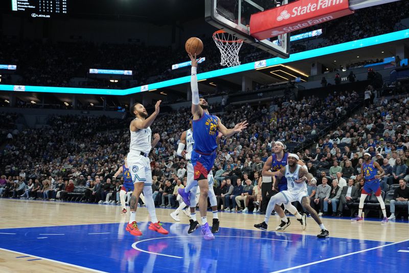 MINNEAPOLIS, MN -  MARCH 19: Jamal Murray #27 of the Denver Nuggets drives to the basket during the game against the Minnesota Timberwolves on March 19, 2024 at Target Center in Minneapolis, Minnesota. NOTE TO USER: User expressly acknowledges and agrees that, by downloading and or using this Photograph, user is consenting to the terms and conditions of the Getty Images License Agreement. Mandatory Copyright Notice: Copyright 2024 NBAE (Photo by Jordan Johnson/NBAE via Getty Images)