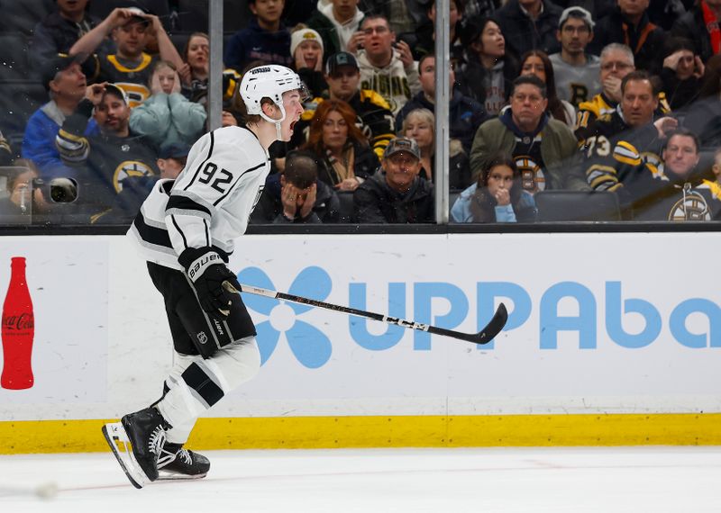 Feb 17, 2024; Boston, Massachusetts, USA; As fans react, Los Angeles Kings defenseman Brandt Clarke (92) celebrates his game winning goal in overtime that defeated the Boston Bruins 5-4 at TD Garden. Mandatory Credit: Winslow Townson-USA TODAY Sports