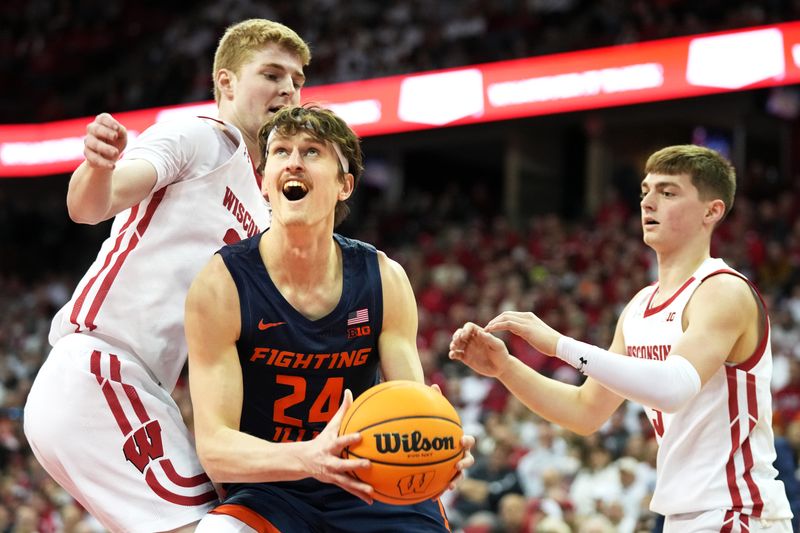 Jan 28, 2023; Madison, Wisconsin, USA;  Illinois Fighting Illini forward Matthew Mayer (24) looks to the basket under coverage by Wisconsin Badgers forward Steven Crowl (22) and Wisconsin Badgers guard Connor Essegian (3) during the first half at the Kohl Center. Mandatory Credit: Kayla Wolf-USA TODAY Sports