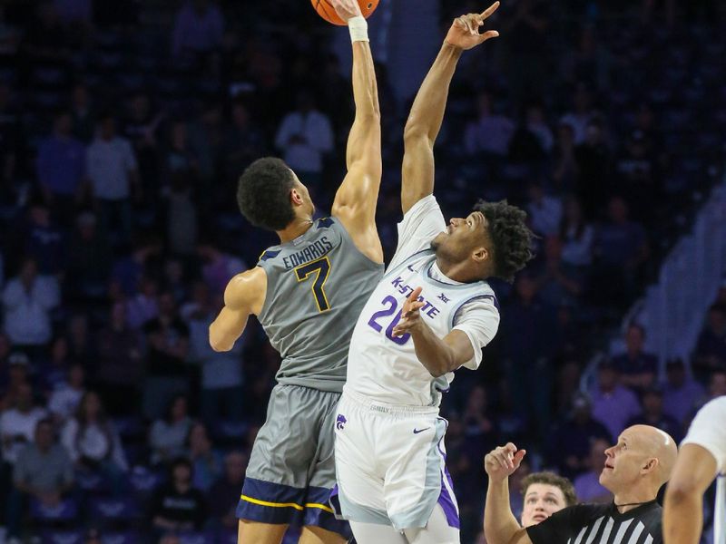 Feb 26, 2024; Manhattan, Kansas, USA; West Virginia Mountaineers center Jesse Edwards (7) and Kansas State Wildcats forward Jerrell Colbert (20) during a jump ball to start overtime at Bramlage Coliseum. Mandatory Credit: Scott Sewell-USA TODAY Sports