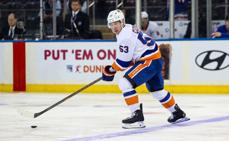 Sep 24, 2024; New York, New York, USA; New York Islanders center Casey Cizikas (53) controls the puck against the New York Rangers during the first period at Madison Square Garden. Mandatory Credit: Danny Wild-Imagn Images