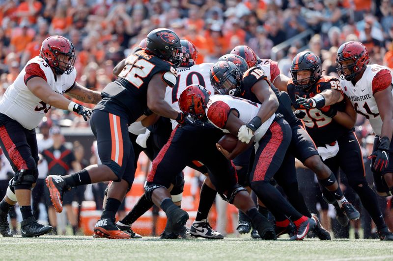 Sep 16, 2023; Corvallis, Oregon, USA; Oregon State Beavers linebacker Andrew Chatfield Jr. (10) sacks San Diego State Aztecs quarterback Jalen Mayden (18)  during the first half at Reser Stadium. Mandatory Credit: Soobum Im-USA TODAY Sports