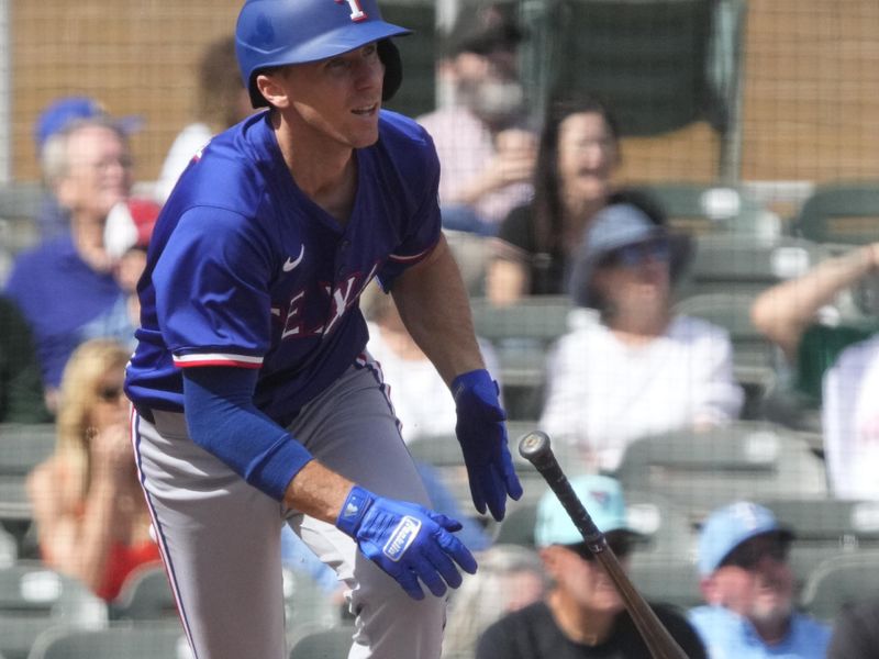 Feb 27, 2024; Salt River Pima-Maricopa, Arizona, USA; Texas Rangers third baseman Matt Duffy (9) hits a single against the Arizona Diamondbacks during the second inning at Salt River Fields at Talking Stick. Mandatory Credit: Rick Scuteri-USA TODAY Sports