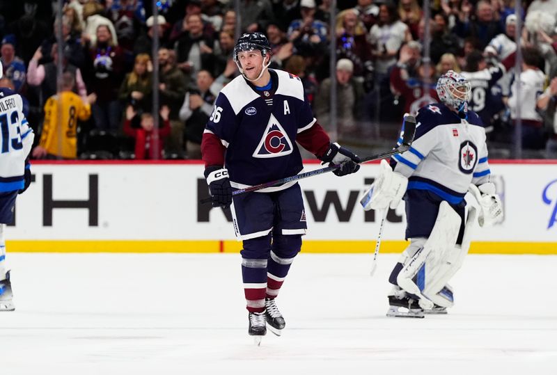 Dec 31, 2024; Denver, Colorado, USA; Colorado Avalanche right wing Mikko Rantanen (96) celebrates his goal in the third period against the Winnipeg Jets at Ball Arena. Mandatory Credit: Ron Chenoy-Imagn Images