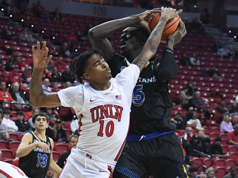 Feb 14, 2023; Las Vegas, Nevada, USA; UNLV Runnin' Rebels guard Keshon Gilbert (10) and San Jose State Spartans center Ibrahima Diallo (5) battle for a rebound in the first half at Thomas & Mack Center. Mandatory Credit: Candice Ward-USA TODAY Sports