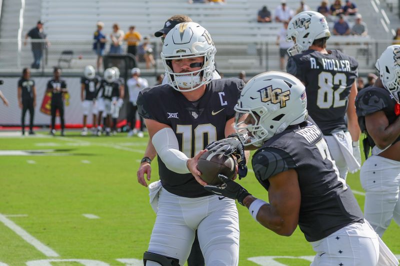 Oct 28, 2023; Orlando, Florida, USA; UCF Knights quarterback John Rhys Plumlee (10) warms up before the game against the West Virginia Mountaineers at FBC Mortgage Stadium. Mandatory Credit: Mike Watters-USA TODAY Sports