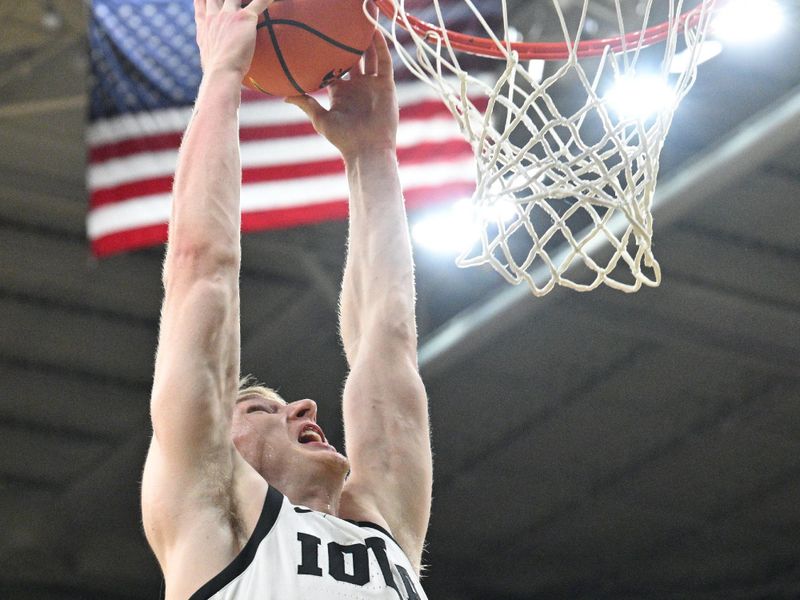 Feb 27, 2024; Iowa City, Iowa, USA; Iowa Hawkeyes guard Josh Dix (4) goes to the basket against the Penn State Nittany Lions during the second half at Carver-Hawkeye Arena. Mandatory Credit: Jeffrey Becker-USA TODAY Sports