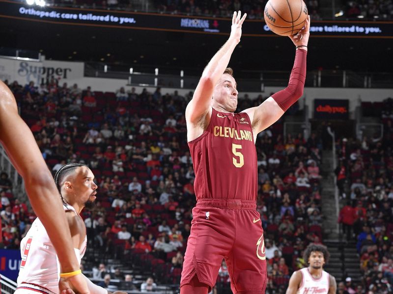 HOUSTON, TX - MARCH 16:  Sam Merrill #5 of the Cleveland Cavaliers grabs a rebound during the game against the Houston Rockets on March 16, 2023 at the Toyota Center in Houston, Texas. NOTE TO USER: User expressly acknowledges and agrees that, by downloading and or using this photograph, User is consenting to the terms and conditions of the Getty Images License Agreement. Mandatory Copyright Notice: Copyright 2024 NBAE (Photo by Logan Riely/NBAE via Getty Images)