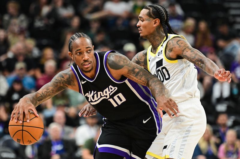 SALT LAKE CITY, UTAH - OCTOBER 15:  DeMar DeRozan #10 of the Sacramento Kings drives into Jordan Clarkson #00 of the Utah Jazz during the first half of a preseason game at Delta Center on October 15, 2024 in Salt Lake City, Utah. NOTE TO USER: User expressly acknowledges and agrees that, by downloading and or using this photograph, User is consenting to the terms and conditions of the Getty Images License Agreement. (Photo by Alex Goodlett/Getty Images)