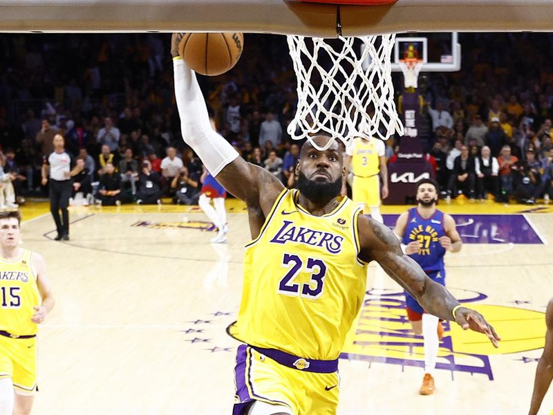 LOS ANGELES, CALIFORNIA - APRIL 25:  LeBron James #23 of the Los Angeles Lakers makes a slam dunk against the Denver Nuggets in the first quarter during game three of the Western Conference First Round Playoffs at Crypto.com Arena on April 25, 2024 in Los Angeles, California.  (Photo by Ronald Martinez/Getty Images)