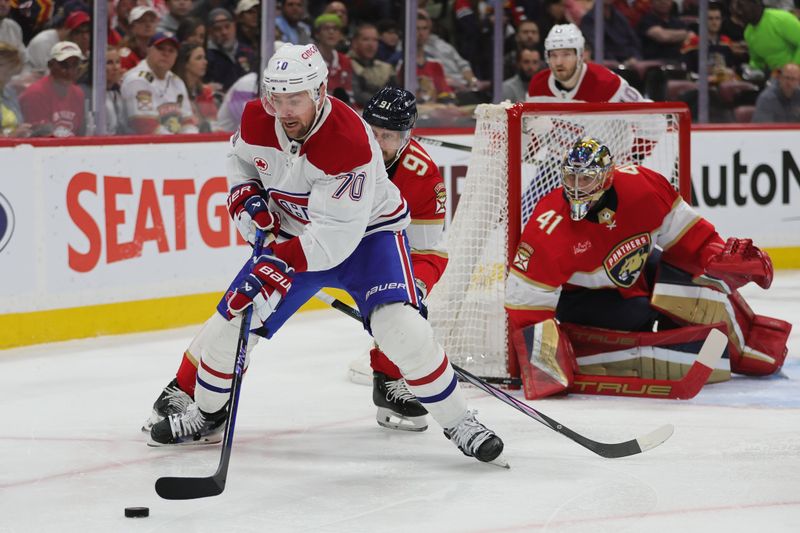 Feb 29, 2024; Sunrise, Florida, USA; Montreal Canadiens left wing Tanner Pearson (70) moves the puck ahead of Florida Panthers defenseman Oliver Ekman-Larsson (91) during the first period at Amerant Bank Arena. Mandatory Credit: Sam Navarro-USA TODAY Sports