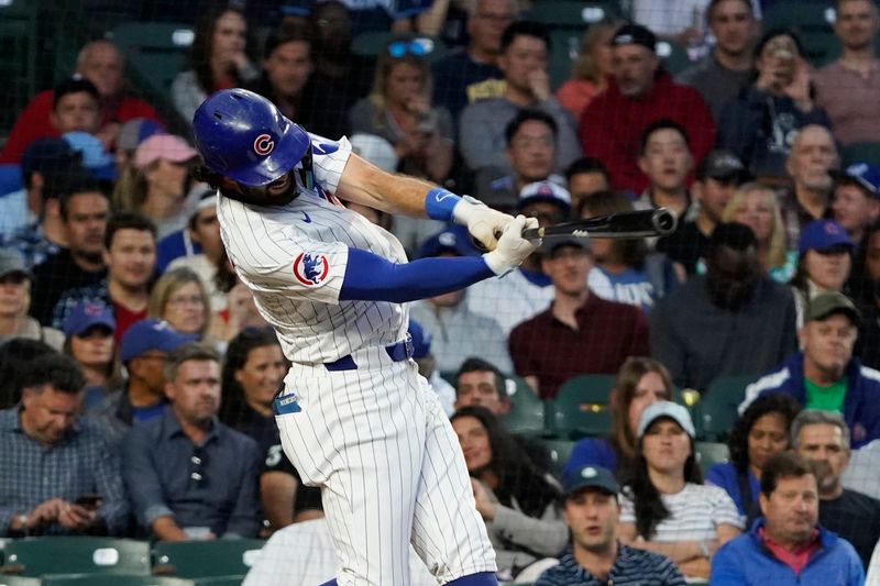 Sep 3, 2024; Chicago, Illinois, USA; Chicago Cubs shortstop Dansby Swanson (7) hits a single against the Pittsburgh Pirates during the second inning at Wrigley Field. Mandatory Credit: David Banks-Imagn Images