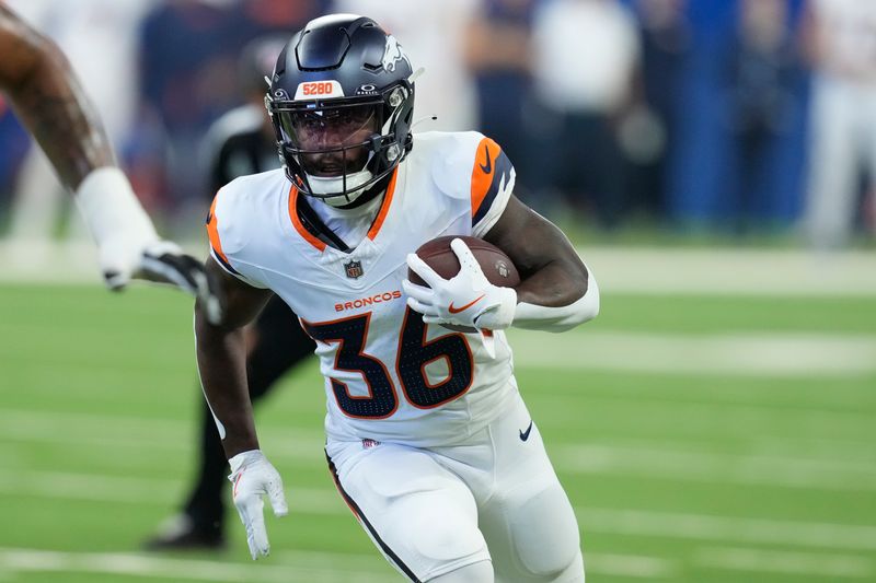 Denver Broncos running back Tyler Badie (36) carries the ball against the Indianapolis Colts during the second half of a preseason NFL football game, Sunday, Aug. 11, 2024, in Westfield, Ind. (AP Photo/Darron Cummings)