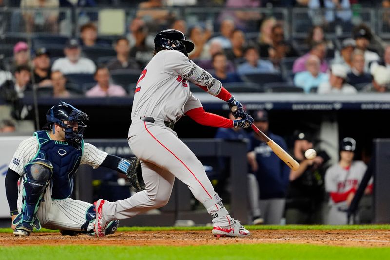 Sep 12, 2024; Bronx, New York, USA; Boston Red Sox right fielder Wilyer Abreu (52) hits a single against the New York Yankees during the fifth inning at Yankee Stadium. Mandatory Credit: Gregory Fisher-Imagn Images