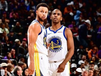 PHOENIX, AZ - DECEMBER 12: Stephen Curry #30 and Chris Paul #3 of the Golden State Warriors look on during the game against the Phoenix Suns on December 12, 2023 at Footprint Center in Phoenix, Arizona. NOTE TO USER: User expressly acknowledges and agrees that, by downloading and or using this photograph, user is consenting to the terms and conditions of the Getty Images License Agreement. Mandatory Copyright Notice: Copyright 2023 NBAE (Photo by Barry Gossage/NBAE via Getty Images)