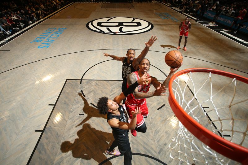 BROOKLYN, NY - MARCH 29: DeMar DeRozan #11 of the Chicago Bulls drives to the basket during the game against the Brooklyn Nets on March 29, 2024 at Barclays Center in Brooklyn, New York. NOTE TO USER: User expressly acknowledges and agrees that, by downloading and or using this Photograph, user is consenting to the terms and conditions of the Getty Images License Agreement. Mandatory Copyright Notice: Copyright 2024 NBAE (Photo by Nathaniel S. Butler/NBAE via Getty Images)