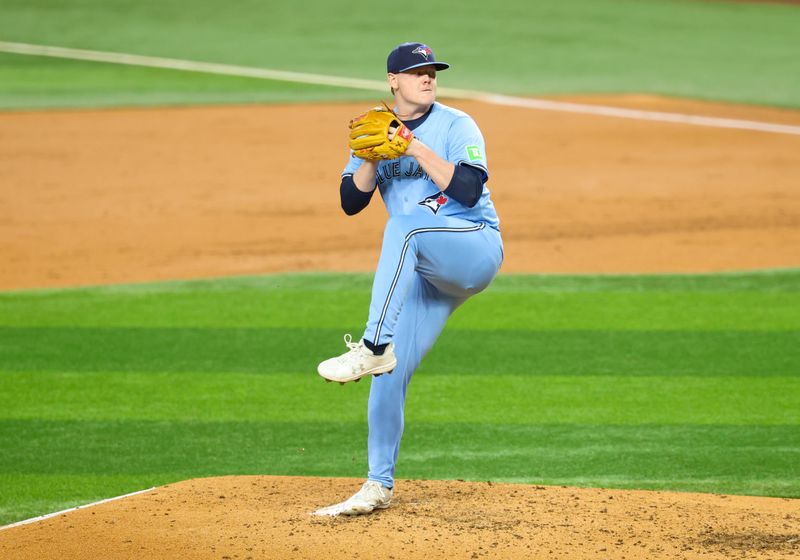 May 28, 2025; Arlington, Texas, USA; Toronto Blue Jays starting pitcher Paxton Schultz (65) throws during the third inning against the Texas Rangers at Globe Life Field. Mandatory Credit: Kevin Jairaj-Imagn Images