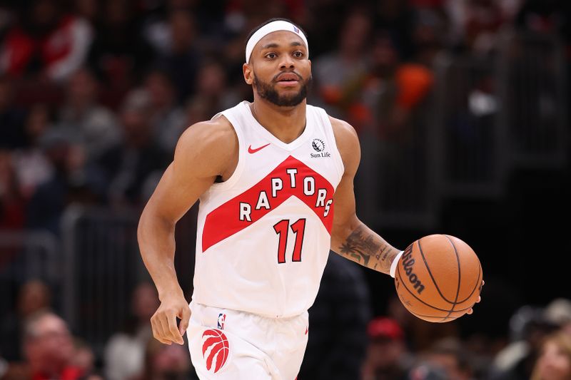 CHICAGO, ILLINOIS - JANUARY 30: Bruce Brown #11 of the Toronto Raptors dribbles up the court against the Chicago Bulls during the second half at the United Center on January 30, 2024 in Chicago, Illinois. NOTE TO USER: User expressly acknowledges and agrees that, by downloading and or using this photograph, User is consenting to the terms and conditions of the Getty Images License Agreement.  (Photo by Michael Reaves/Getty Images)