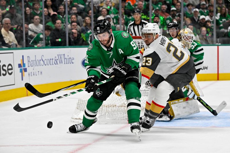 May 1, 2024; Dallas, Texas, USA; Dallas Stars center Tyler Seguin (91) and Vegas Golden Knights defenseman Alec Martinez (23) chase the puck in the Vegas zone during the second period in game five of the first round of the 2024 Stanley Cup Playoffs at the American Airlines Center. Mandatory Credit: Jerome Miron-USA TODAY Sports