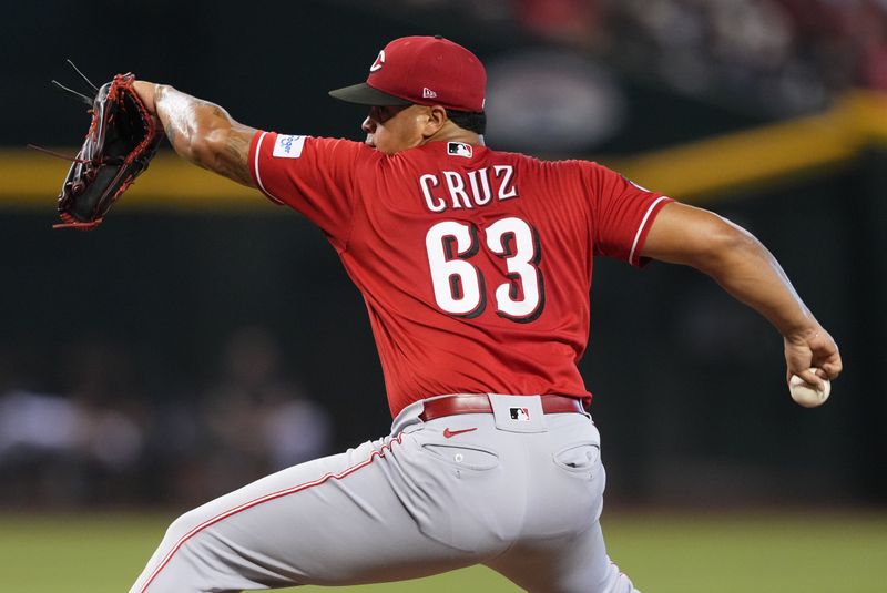 Aug 26, 2023; Phoenix, Arizona, USA; Cincinnati Reds starting pitcher Fernando Cruz (63) pitches against the Arizona Diamondbacks during the first inning at Chase Field. Mandatory Credit: Joe Camporeale-USA TODAY Sports