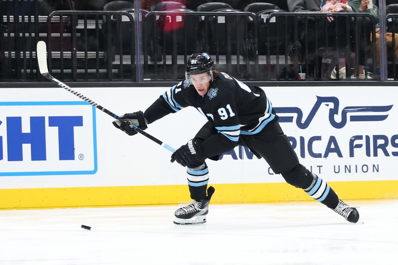 Oct 24, 2024; Salt Lake City, Utah, USA; Utah Hockey Club right wing Josh Doan (91) skates with the puck against against the Colorado Avalanche during the second period at Delta Center. Mandatory Credit: Rob Gray-Imagn Images