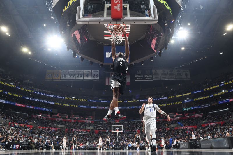 LOS ANGELES, CA - APRIL 23: Kawhi Leonard #2 of the LA Clippers dunks the ball during the game against the Dallas Mavericks during Round 1 Game 2 of the 2024 NBA Playoffs on April 23, 2024 at Crypto.Com Arena in Los Angeles, California. NOTE TO USER: User expressly acknowledges and agrees that, by downloading and/or using this Photograph, user is consenting to the terms and conditions of the Getty Images License Agreement. Mandatory Copyright Notice: Copyright 2024 NBAE (Photo by Andrew D. Bernstein/NBAE via Getty Images)