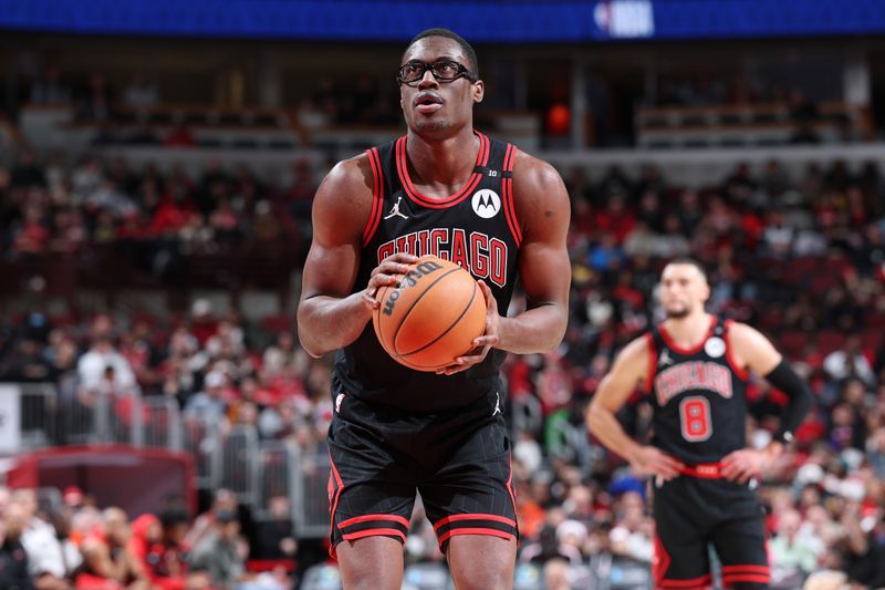 CHICAGO, IL - DECEMBER 13: Jalen Smith #7 of the Chicago Bulls shoots a free throw during the game against the Charlotte Hornets on December 13, 2024 at United Center in Chicago, Illinois. NOTE TO USER: User expressly acknowledges and agrees that, by downloading and or using this photograph, User is consenting to the terms and conditions of the Getty Images License Agreement. Mandatory Copyright Notice: Copyright 2024 NBAE (Photo by Jeff Haynes/NBAE via Getty Images)