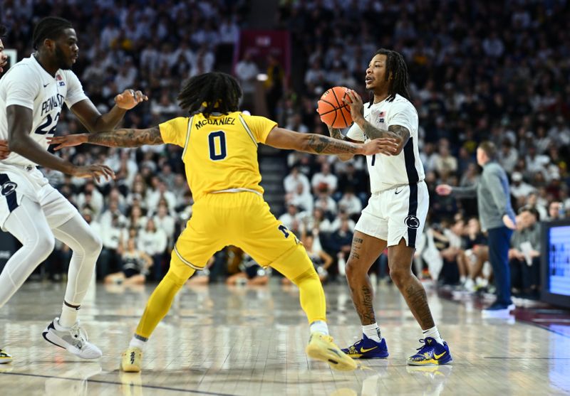 Jan 7, 2024; Philadelphia, Pennsylvania, USA; Penn State Nittany Lions guard Ace Baldwin Jr (1) controls the ball against Michigan Wolverines guard Dug McDaniel (0) in the first half at The Palestra. Mandatory Credit: Kyle Ross-USA TODAY Sports