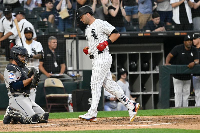 Jun 19, 2024; Chicago, Illinois, USA;  Chicago White Sox outfielder Andrew Benintendi (23) crosses home plate after hitting a home run against the Houston Astros during the fourth inning at Guaranteed Rate Field. Mandatory Credit: Matt Marton-USA TODAY Sports