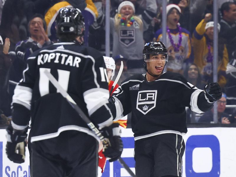 Dec 23, 2023; Los Angeles, California, USA; Los Angeles Kings right wing Quinton Byfield (55) celebrates after scoring a goal against the Calgary Flames during the third period of a game at Crypto.com Arena. Mandatory Credit: Jessica Alcheh-USA TODAY Sports