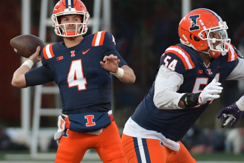 Nov 25, 2023; Champaign, Illinois, USA; Illinois Fighting Illini quarterback John Paddock (4) passes the ball during the first half against the Northwestern Wildcats at Memorial Stadium. Mandatory Credit: Ron Johnson-USA TODAY Sports