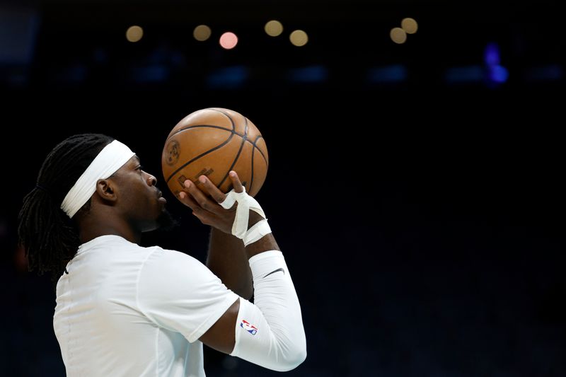 CHARLOTTE, NORTH CAROLINA - DECEMBER 29: Luguentz Dort #5 of the Oklahoma City Thunder warms up prior to the game against the Charlotte Hornets at Spectrum Center on December 29, 2022 in Charlotte, North Carolina. NOTE TO USER: User expressly acknowledges and agrees that, by downloading and or using this photograph, User is consenting to the terms and conditions of the Getty Images License Agreement. (Photo by Jared C. Tilton/Getty Images)