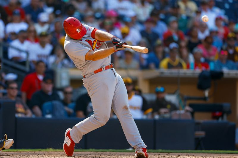 Sep 24, 2023; San Diego, California, USA;  St. Louis Cardinals first baseman Luken Baker (26) hits a two run home run in the seventh inning against the San Diego Padres at Petco Park. Mandatory Credit: David Frerker-USA TODAY Sports