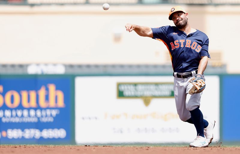 Mar 21, 2024; Jupiter, Florida, USA; Houston Astros second baseman Jose Altuve (27)throws the ball back to starting pitcher J.P. France (68) against the St. Louis Cardinals in the second inning at Roger Dean Chevrolet Stadium. Mandatory Credit: Rhona Wise-USA TODAY Sports