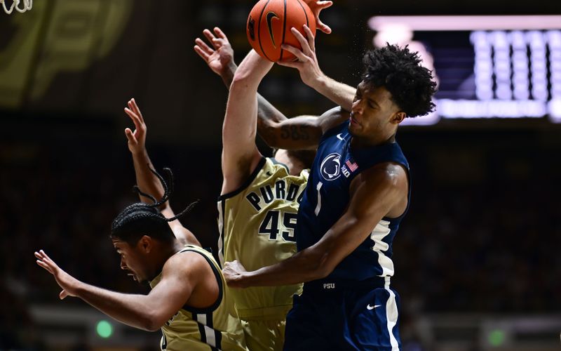 Jan 10, 2026; West Lafayette, Indiana, USA;  Penn State Nittany Lions forward Mason Blackwood (1) fights for a rebound against Purdue Boilermakers center Oscar Cluff (45) during the first half at Mackey Arena. Mandatory Credit: Marc Lebryk-Imagn Images