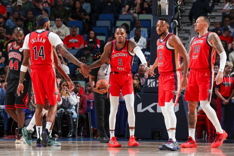 NEW ORLEANS, LA - OCTOBER 23: Dejounte Murray #5 of the New Orleans Pelicans high-fives teammates CJ McCollum #3 and Brandon Ingram #14 during the game on October 23, 2024 at the Smoothie King Center in New Orleans, Louisiana. NOTE TO USER: User expressly acknowledges and agrees that, by downloading and or using this Photograph, user is consenting to the terms and conditions of the Getty Images License Agreement. Mandatory Copyright Notice: Copyright 2024 NBAE (Photo by Layne Murdoch Jr./NBAE via Getty Images)