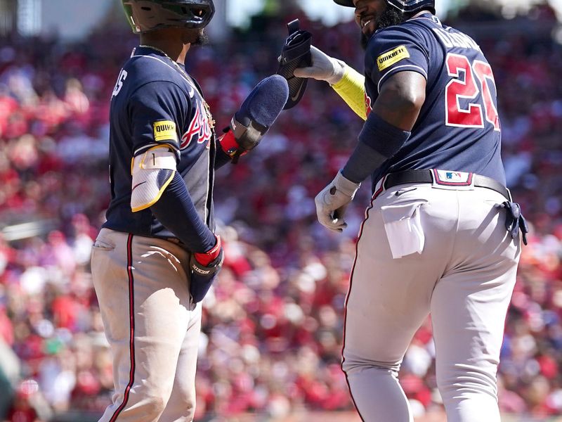 Jun 25, 2023; Cincinnati, Ohio, USA; Atlanta Braves second baseman Ozzie Albies (1) is congratulated after scoring by designated hitter Marcell Ozuna (20) who drew a walk with the bases loaded in the eight inning of a baseball game against the Cincinnati Reds at Great American Ball Park. The Atlanta Braves won, 7-6. Mandatory Credit: Kareem Elgazzar-USA TODAY Sports