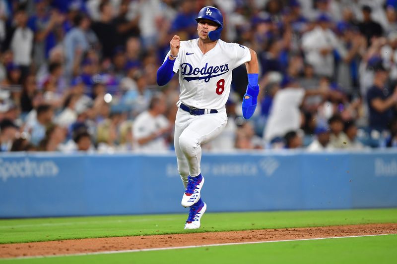 Aug 15, 2023; Los Angeles, California, USA; Los Angeles Dodgers shortstop Enrique Hernandez (8) runs home to score against the Milwaukee Brewers during the sixth inning at Dodger Stadium. Mandatory Credit: Gary A. Vasquez-USA TODAY Sports