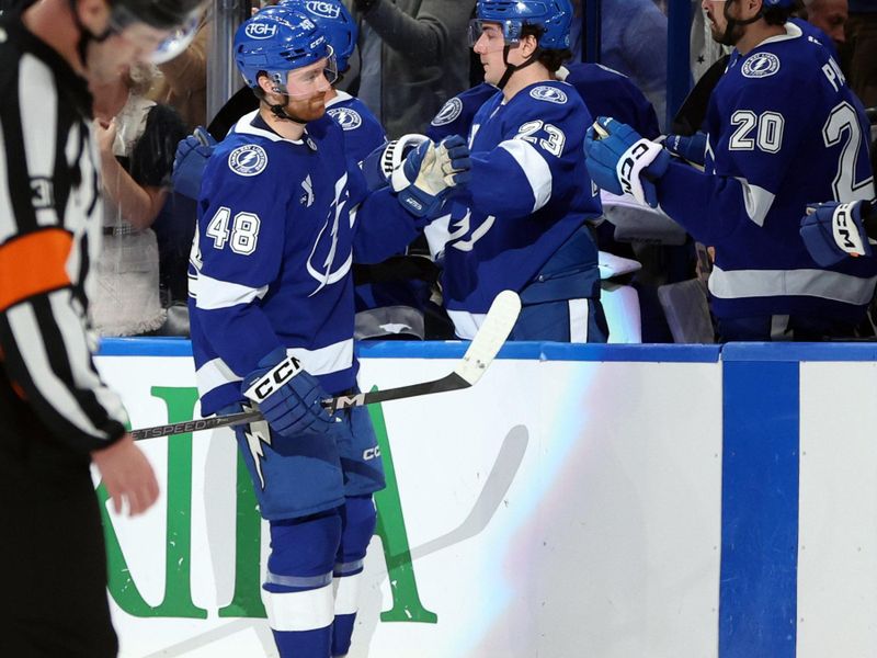 Dec 5, 2024; Tampa, Florida, USA; Tampa Bay Lightning defenseman Nick Perbix (48) is congratulated after he scored a goal against the San Jose Sharks during the second period at Amalie Arena. Mandatory Credit: Kim Klement Neitzel-Imagn Images