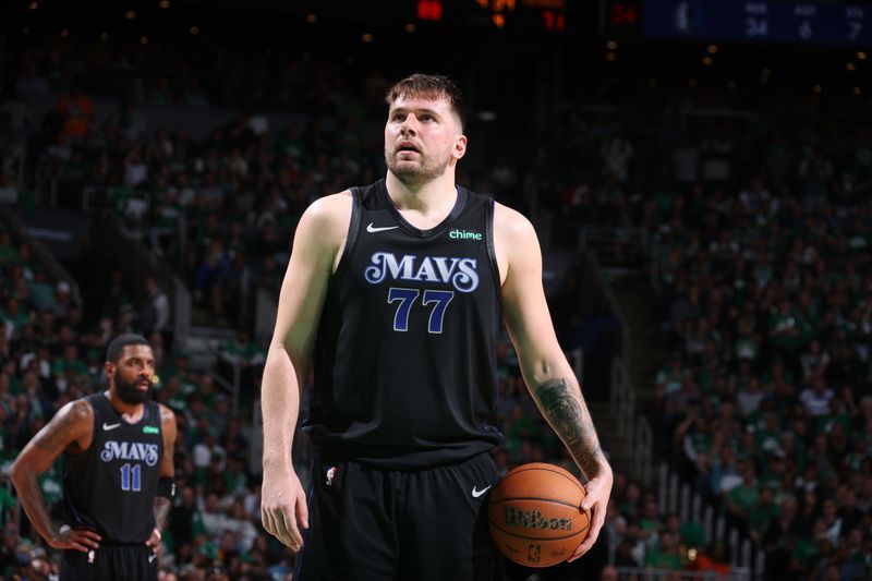 BOSTON, MA - JUNE 6: Luka Doncic #77 of the Dallas Mavericks shoots a free throw during the game against the Boston Celtics during Game 1 of the 2024 NBA Finals on June 6, 2024 at the TD Garden in Boston, Massachusetts. NOTE TO USER: User expressly acknowledges and agrees that, by downloading and or using this photograph, User is consenting to the terms and conditions of the Getty Images License Agreement. Mandatory Copyright Notice: Copyright 2024 NBAE  (Photo by Nathaniel S. Butler/NBAE via Getty Images)