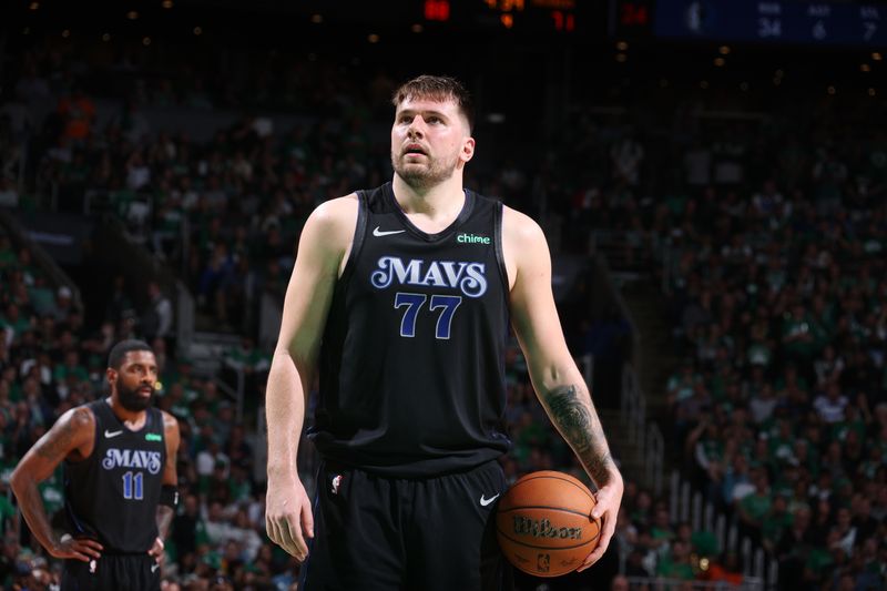 BOSTON, MA - JUNE 6: Luka Doncic #77 of the Dallas Mavericks shoots a free throw during the game against the Boston Celtics during Game 1 of the 2024 NBA Finals on June 6, 2024 at the TD Garden in Boston, Massachusetts. NOTE TO USER: User expressly acknowledges and agrees that, by downloading and or using this photograph, User is consenting to the terms and conditions of the Getty Images License Agreement. Mandatory Copyright Notice: Copyright 2024 NBAE  (Photo by Nathaniel S. Butler/NBAE via Getty Images)