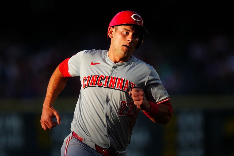 Jun 4, 2024; Denver, Colorado, USA; Cincinnati Reds catcher Luke Maile (22) runs to third in the fourth inning against the Cincinnati Reds at Coors Field. Mandatory Credit: Ron Chenoy-USA TODAY Sports