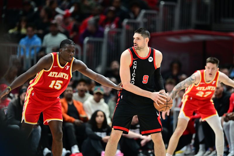 CHICAGO, IL - APRIL 1: Nikola Vucevic #9 of the Chicago Bulls handles the ball during the game against the Atlanta Hawks on April 1, 2024 at United Center in Chicago, Illinois. NOTE TO USER: User expressly acknowledges and agrees that, by downloading and or using this photograph, User is consenting to the terms and conditions of the Getty Images License Agreement. Mandatory Copyright Notice: Copyright 2024 NBAE (Photo by Adam Hagy/NBAE via Getty Images)