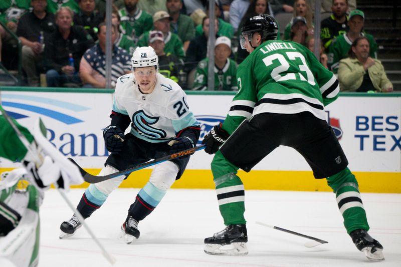 May 15, 2023; Dallas, Texas, USA; Seattle Kraken right wing Eeli Tolvanen (20) loses control of his stick as he attempts to skate past Dallas Stars defenseman Esa Lindell (23) during the third period in game seven of the second round of the 2023 Stanley Cup Playoffs at the American Airlines Center. Mandatory Credit: Jerome Miron-USA TODAY Sports