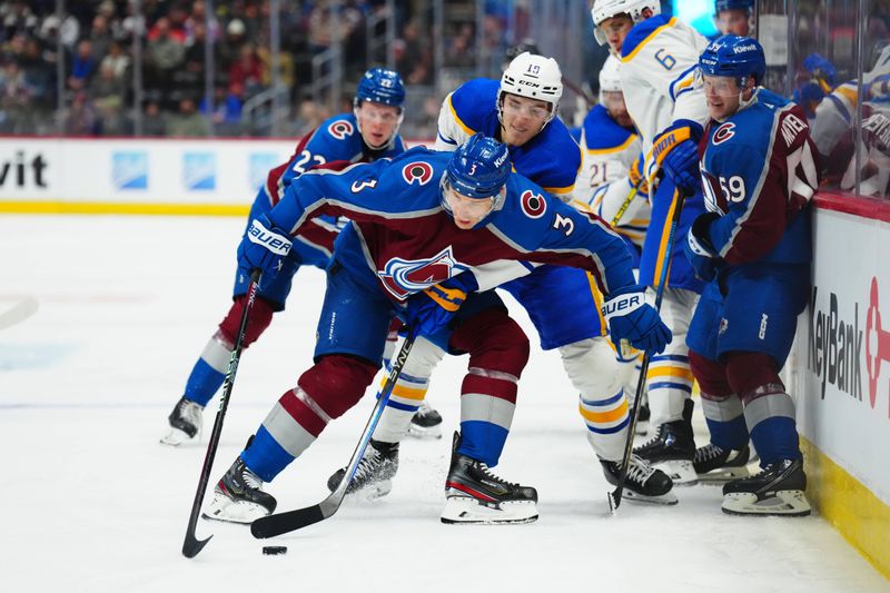 Dec 13, 2023; Denver, Colorado, USA; Buffalo Sabres center Peyton Krebs (19) and Colorado Avalanche defenseman Jack Johnson (3) battle for the puck in the third period at Ball Arena. Mandatory Credit: Ron Chenoy-USA TODAY Sports