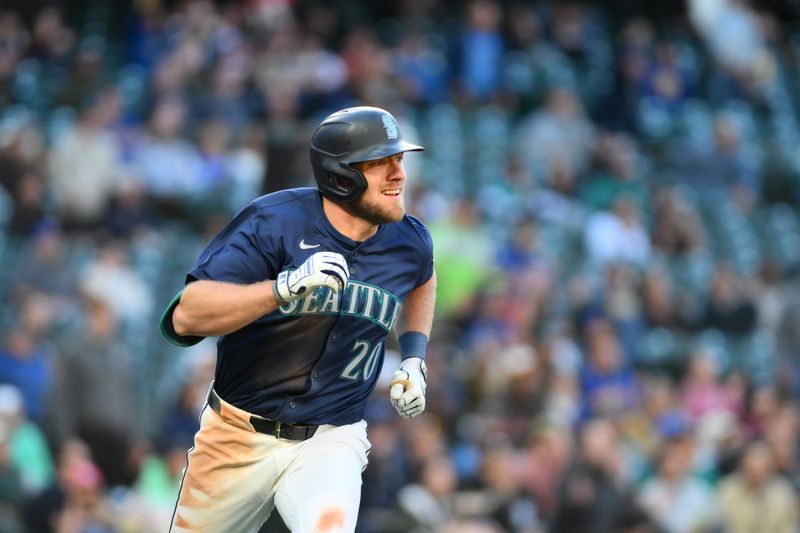 Jun 12, 2024; Seattle, Washington, USA; Seattle Mariners left fielder Luke Raley (20) runs the bases after hitting a home run against the Chicago White Sox during the seventh inning at T-Mobile Park. Mandatory Credit: Steven Bisig-USA TODAY Sports