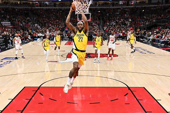 CHICAGO, ILLINOIS - DECEMBER 28:  Isaiah Jackson #22 of the Indiana Pacers finishes off a fast break with a dunk in the first half against the Chicago Bulls on December 28, 2023 at the United Center in Chicago, Illinois. Indiana defeated Chicago 120-104.   NOTE TO USER: User expressly acknowledges and agrees that, by downloading and or using this photograph, User is consenting to the terms and conditions of the Getty Images License Agreement.  (Photo by Jamie Sabau/Getty Images)