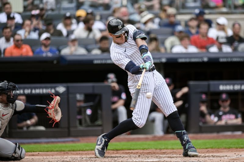 Aug 22, 2024; Bronx, New York, USA; New York Yankees outfielder Aaron Judge (99) hits a solo home run against the Cleveland Guardians during the fourth inning at Yankee Stadium. Mandatory Credit: John Jones-USA TODAY Sports